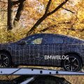 2027 BMW iX4 prototype spied testing with sloping coupe roofline